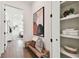 Hallway with bench seating, built-in shelving, and artwork at 3035 1St S Ave, St Petersburg, FL 33712