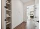 Bright hallway with built-in shelving and linen closet at 3035 1St S Ave, St Petersburg, FL 33712