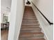 Modern staircase with wood treads and dark metal railing at 3035 1St S Ave, St Petersburg, FL 33712