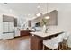 Modern kitchen with two-toned cabinetry, quartz countertops, and island seating at 3035 1St S Ave, St Petersburg, FL 33712