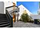 Private backyard patio area with staircase and modern design elements at 3035 1St S Ave, St Petersburg, FL 33712