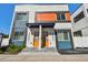 Modern townhomes featuring bright color accents, covered entries, and contemporary design elements at 3035 1St S Ave, St Petersburg, FL 33712