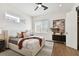 Spacious bedroom with a comfortable bed and a ceiling fan at 3035 1St S Ave, St Petersburg, FL 33712