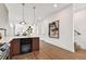 Kitchen island with wine cooler and view into living area at 3035 1St S Ave, St Petersburg, FL 33712