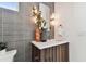 Stylish bathroom vanity with gray tile and wood cabinet at 3035 1St S Ave, St Petersburg, FL 33712