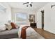 Comfortable bedroom with a queen bed and a ceiling fan at 3035 1St S Ave, St Petersburg, FL 33712