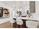 Kitchen island with white countertop, pendant lighting, and seating, ideal for dining or entertaining at 3035 1St S Ave, St Petersburg, FL 33712