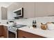 Modern kitchen features stainless steel appliances, stylish cabinets, and elegant countertops at 3035 1St S Ave, St Petersburg, FL 33712