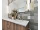Double vanity bathroom with modern light fixtures and stylish tile at 3035 1St S Ave, St Petersburg, FL 33712