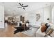 Bright living room offering hardwood floors and modern decor that transitions to a dining and kitchen area at 3035 1St S Ave, St Petersburg, FL 33712