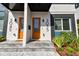 Modern duplex with orange doors and gray accents at 3035 1St S Ave, St Petersburg, FL 33712