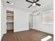 Bright bedroom with wood floors, ceiling fan, and ample closet space at 3035 1St S Ave, St Petersburg, FL 33712