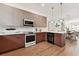 Open concept kitchen with island, dining area, and stainless steel appliances at 3035 1St S Ave, St Petersburg, FL 33712