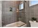 Clean bathroom with gray tile and a glass shower door at 3035 1St S Ave, St Petersburg, FL 33712