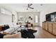 Spacious living room with sectional sofa, hardwood floors, and built-in entertainment center at 3035 1St S Ave, St Petersburg, FL 33712