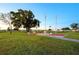 Community area with flags and benches at 36752 Grace Ave, Zephyrhills, FL 33542