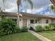 Front view of condo showing entrance and landscaping at 40 Sylvia Pl, Oldsmar, FL 34677