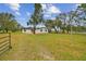 Ranch house with large front yard and gated entrance at 4401 Platt Rd, Plant City, FL 33565