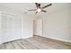 Spacious bedroom with wood-look flooring and large closet at 4401 Platt Rd, Plant City, FL 33565