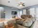 Living room features grey walls, a large TV, and comfortable sofas at 4802 Tomco Dr, Plant City, FL 33565