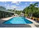 Relaxing kidney-shaped pool with brick pavers and tropical landscaping at 5104 W San Jose St, Tampa, FL 33629