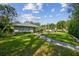 Spacious backyard with stone pathway and lush landscaping at 5104 W San Jose St, Tampa, FL 33629