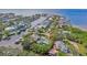 Aerial view of a waterfront home with a private pool and lush landscaping at 5104 W San Jose St, Tampa, FL 33629