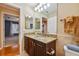 Bathroom with granite countertops and double vanity at 5479 Blue Heron Ln, Wesley Chapel, FL 33543