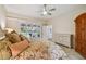 Main bedroom with backyard access and walk-in closet at 5479 Blue Heron Ln, Wesley Chapel, FL 33543