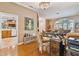 Bright home office with built-in desk and view into the kitchen at 5479 Blue Heron Ln, Wesley Chapel, FL 33543