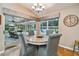 Bright breakfast nook with view of backyard through sliding glass doors at 5479 Blue Heron Ln, Wesley Chapel, FL 33543