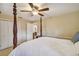 Primary bedroom with a four-poster bed and private bathroom access at 5479 Blue Heron Ln, Wesley Chapel, FL 33543