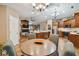Kitchen features an island with seating, and breakfast nook at 5479 Blue Heron Ln, Wesley Chapel, FL 33543