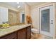 Bathroom with granite countertop, toilet and shower at 5479 Blue Heron Ln, Wesley Chapel, FL 33543