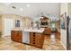 Open concept kitchen with large island and stainless steel appliances at 5479 Blue Heron Ln, Wesley Chapel, FL 33543