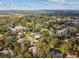 Aerial view of a neighborhood with houses and trees at 5479 Blue Heron Ln, Wesley Chapel, FL 33543