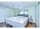 Main bedroom with a king-size bed and light walls at 6028 Ridgewood Dr, Zephyrhills, FL 33542