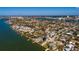 Wide aerial view of waterfront homes in a coastal community offering beautiful canals and city views at 615 78Th Ave, St Pete Beach, FL 33706