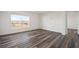 Bedroom with vinyl plank flooring and a window with backyard view at 810 Tidal Rock Ave, Ruskin, FL 33570