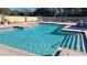 Community swimming pool with plenty of lounge chairs at 9100 Dr Martin Luther King Jr N St # 706, St Petersburg, FL 33702