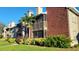 Brick condo building with balconies and lush landscaping at 9100 Dr Martin Luther King Jr N St # 706, St Petersburg, FL 33702