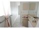 Guest bathroom with single vanity and toilet at 9708 Little Pond Way, Tampa, FL 33647
