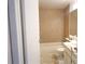 Bathroom featuring tile walls, a vanity, and a bathtub with shower for convenience at 9708 Little Pond Way, Tampa, FL 33647