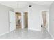 Bright bedroom with tiled floors and access to the bathroom at 9708 Little Pond Way, Tampa, FL 33647