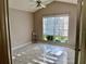 Well-lit bedroom with tile floors and large window with blinds at 9708 Little Pond Way, Tampa, FL 33647