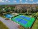 Aerial view of community amenities including tennis and basketball courts, playground at 9708 Little Pond Way, Tampa, FL 33647