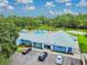 Community clubhouse with pool, parking and landscaping at 9708 Little Pond Way, Tampa, FL 33647