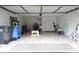 Spacious garage with tiled flooring, offering ample storage and utility space at 9708 Little Pond Way, Tampa, FL 33647