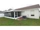Home features a screened patio, fenced yard, and AC unit at 9708 Little Pond Way, Tampa, FL 33647