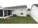 Home features a screened patio, fenced yard, and AC unit at 9708 Little Pond Way, Tampa, FL 33647